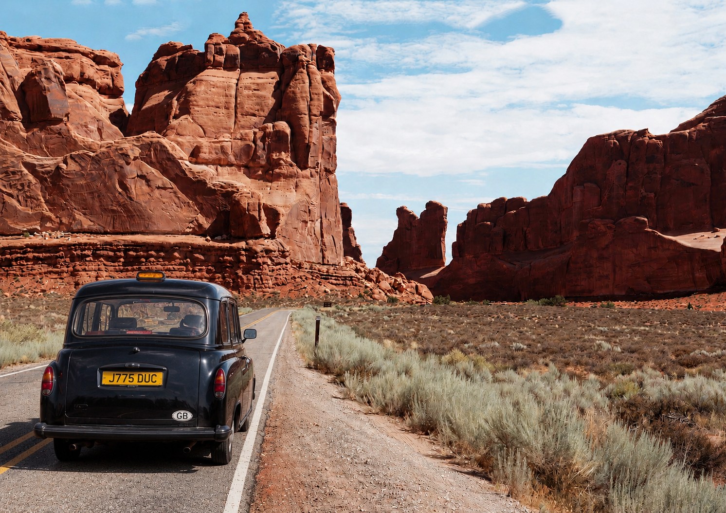 Black 1992 London taxi rolling through Arches National Park red rock country